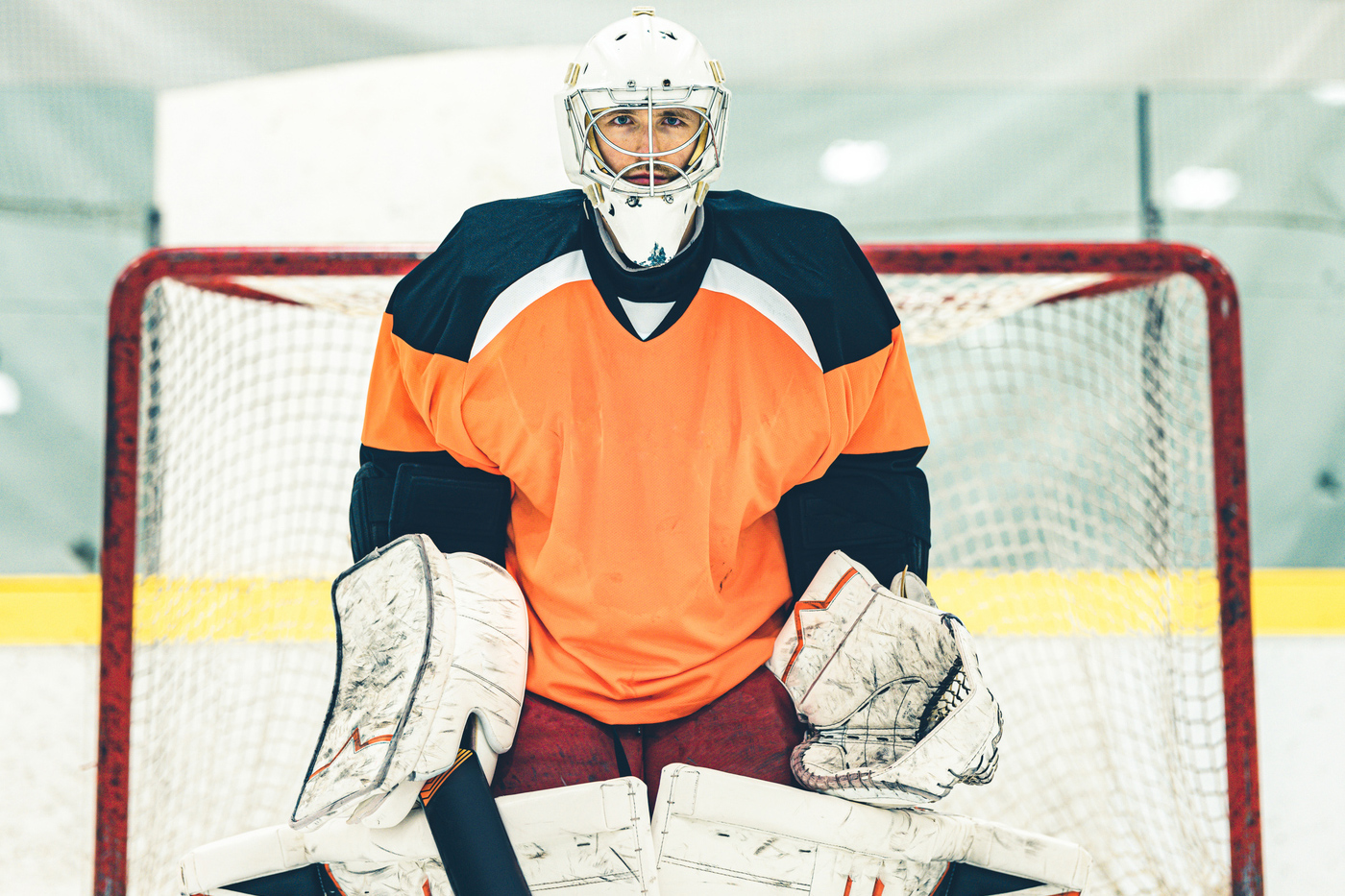 Ice hockey player guards a goal