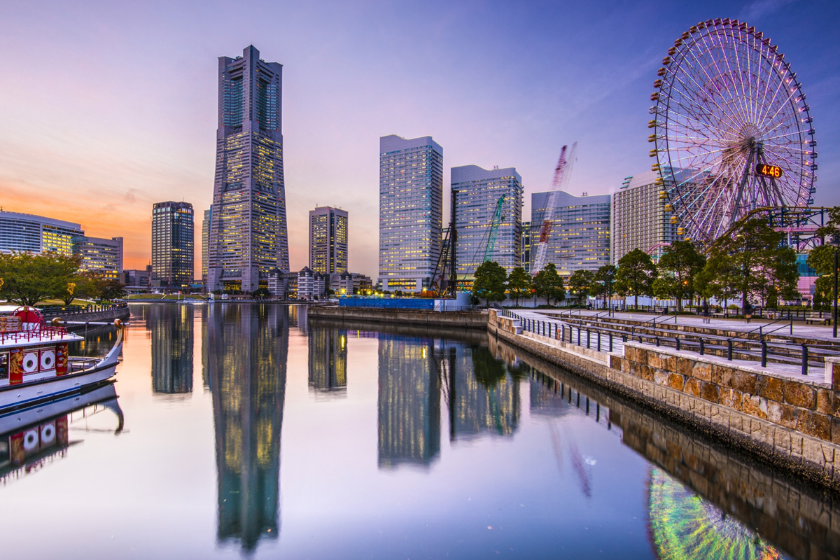 City view of Yokohama with river, skyscrapers and Ferris wheel